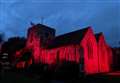 Church bathed in red light for Armistice Day