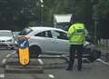 Road delays after car crashes into lamppost