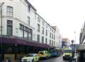 Woman hit by bus in town centre