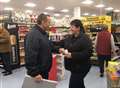 Couple heading down the aisle after discount store proposal