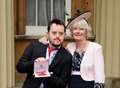 Dedicated mum collects MBE from Palace