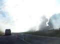 Plumes of smoke following van fire