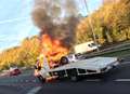 Car transporter fire causes traffic chaos