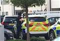 Armed police surround flats 