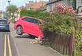 Audi’s wheels off ground after crashing into garden wall