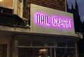 Nail bar's neon sign removed after row
