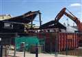 Demolition begins after devastating harbour fire