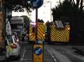 Delays as man trapped in overturned car