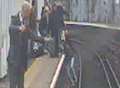 Moment trapped passenger is rescued from path of train