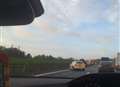 Overturned car closes motorway lane
