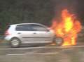 Motorway blocked after car fire