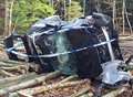 Car wrecked after flip in woods