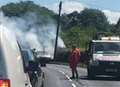 Police shut road after car engulfed in flames