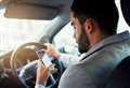 Driver pays hefty fine after using phone behind the wheel