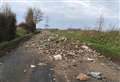 Fury as rubble and rubbish dumped across road