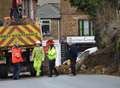 Collapsed wall closes road