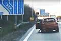 Shocking moment passenger opens door on motorway