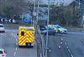 Car smashes into metal barrier at busy roundabout