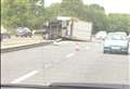 Delays after lorry smashes into central reservation