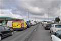 Long delays after three-vehicle crash closes major road