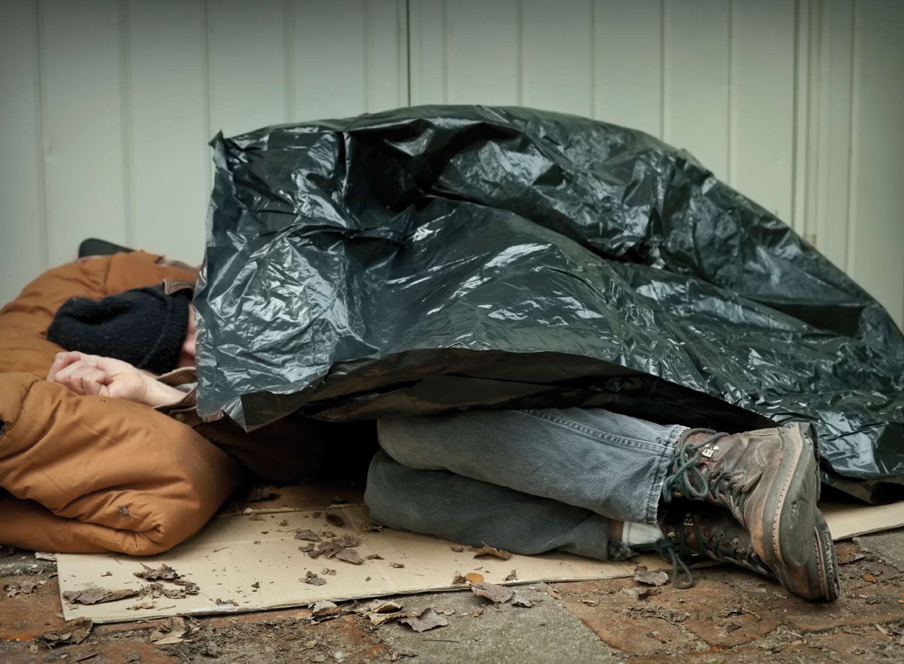 Homeless person living on street. Stock pic.