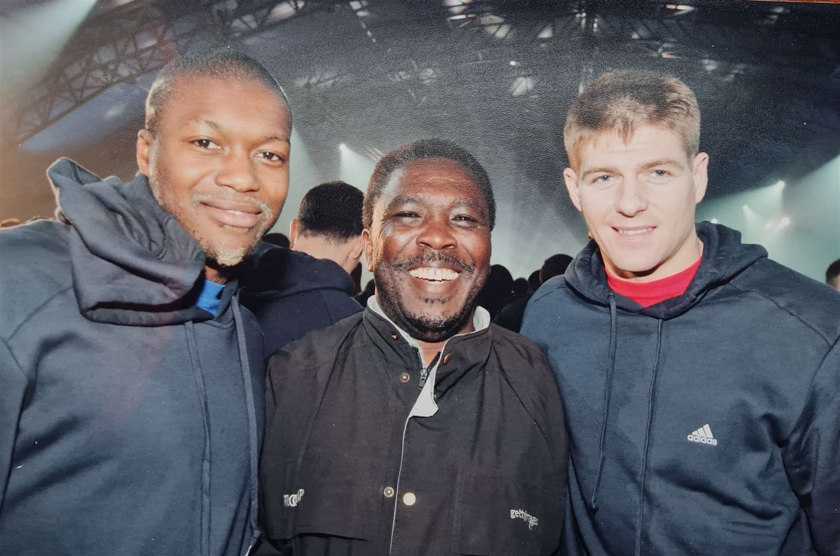 John rubs shoulders with Liverpool FC stars Steven Gerrard and Djibril Cissé
