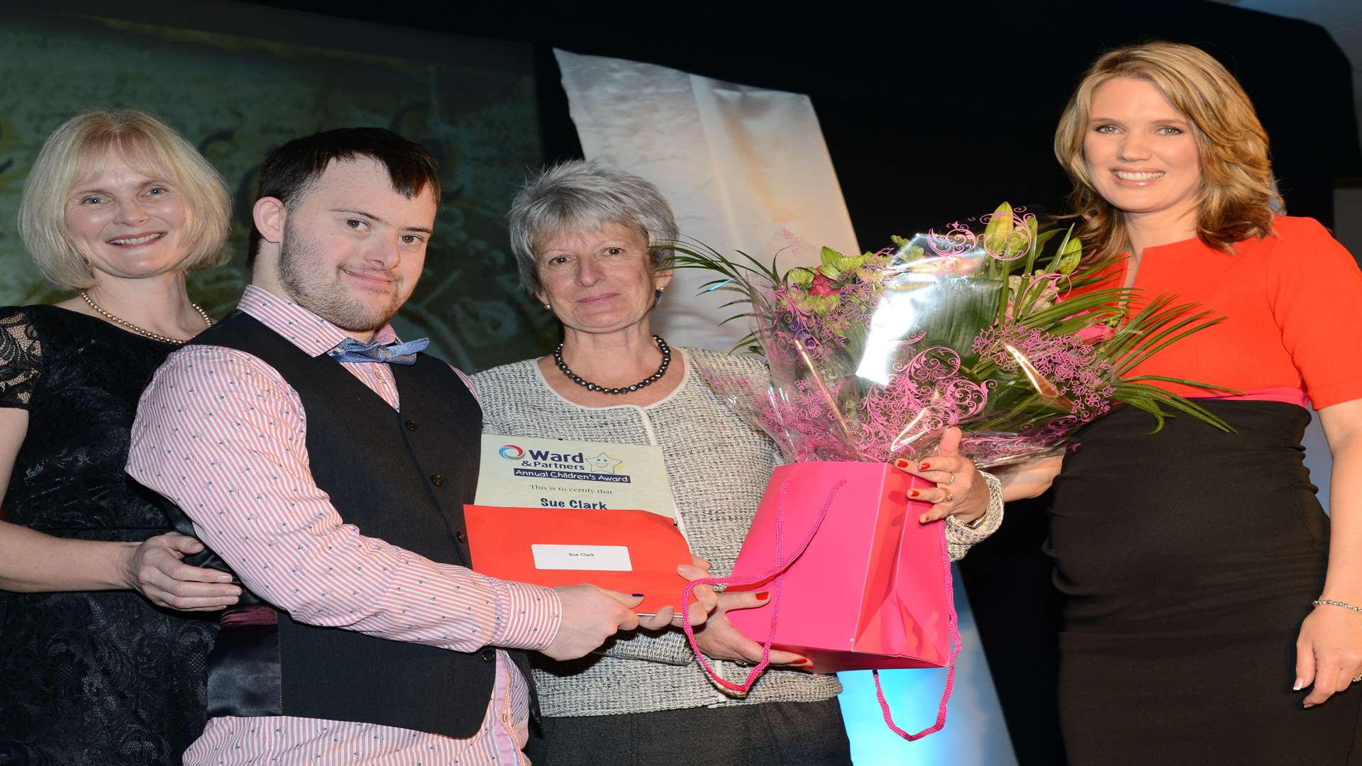 Sue Clark and son Jamie, who won Outstanding Contribution award presented by Carol Lynch and Charlotte Hawkins