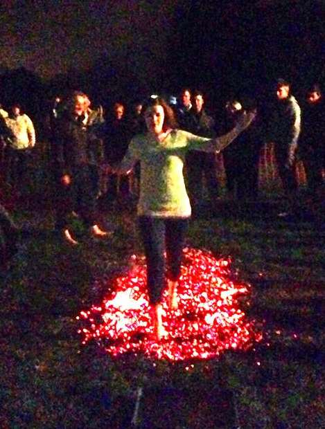 Reporter Lizzie Massey walking over hot coals to raise money to Charlie Russell