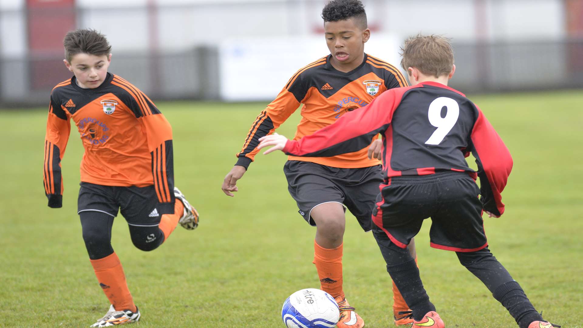 Lordswood Youth (orange) in possession against Meopham Colts in the Under-12 League Cup final Picture: Ruth Cuerden