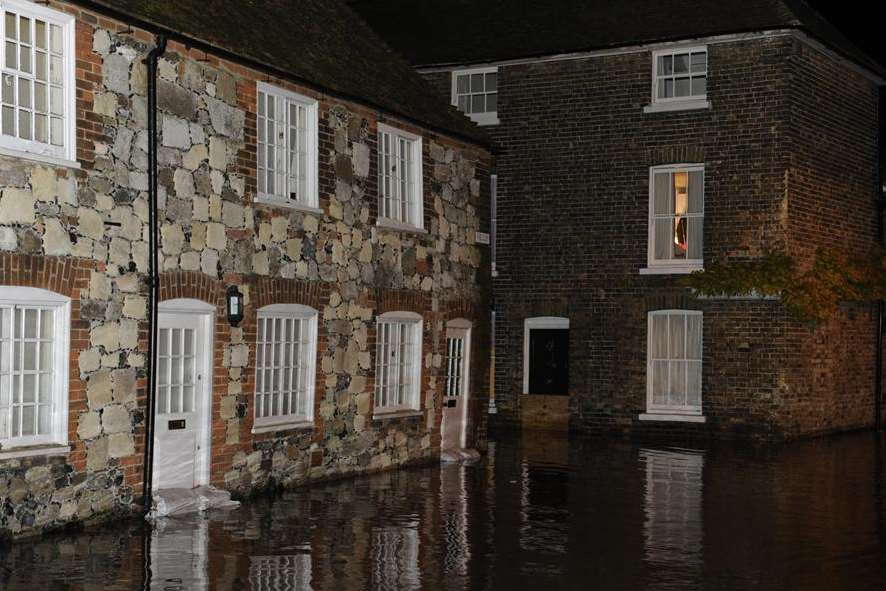 Flood water reached the doors of these homes in The Quay, Sandwich. Picture: Tony Flashman