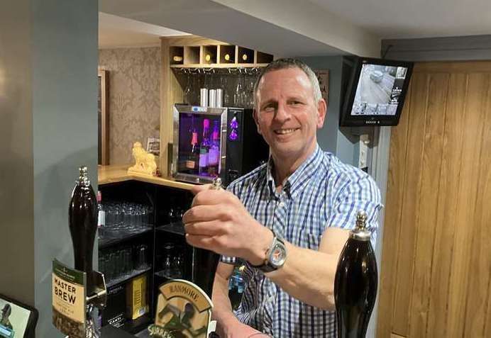 Simon Banfield, manager of Marden Village Club, toasting to yet more success
