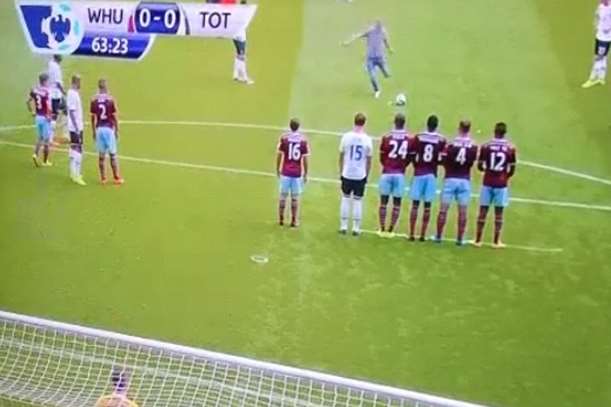 Pitch invader Jordan Dunn takes a free-kick during a West Ham game