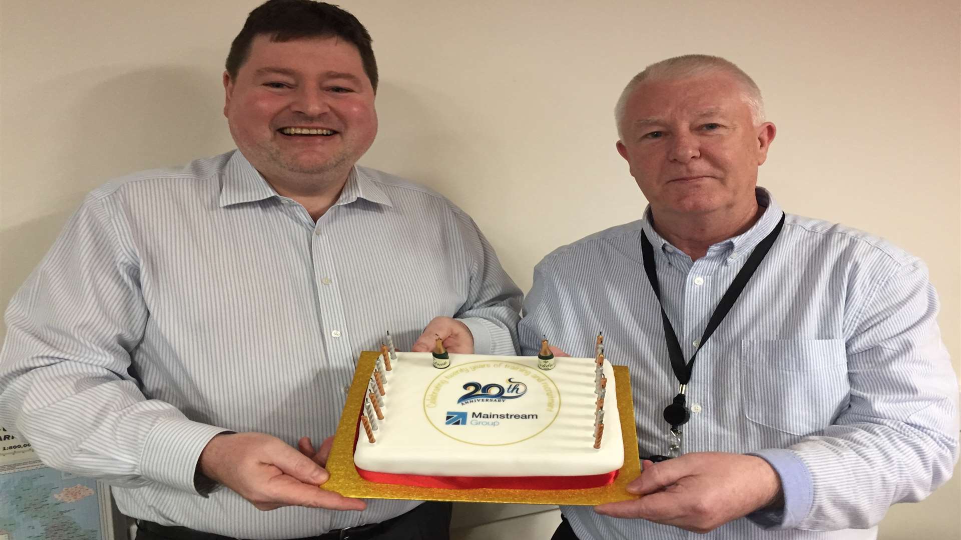 Managing director Mark Smith, left, and company co-founder Mike Smith celebrate Mainstream's 20th anniversary