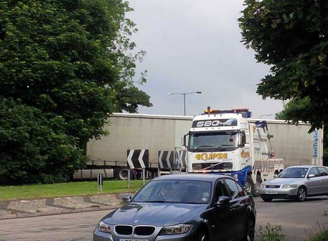 The lorry is submerged in the trees on the roundabout. Picture: Stuart Jaenicke