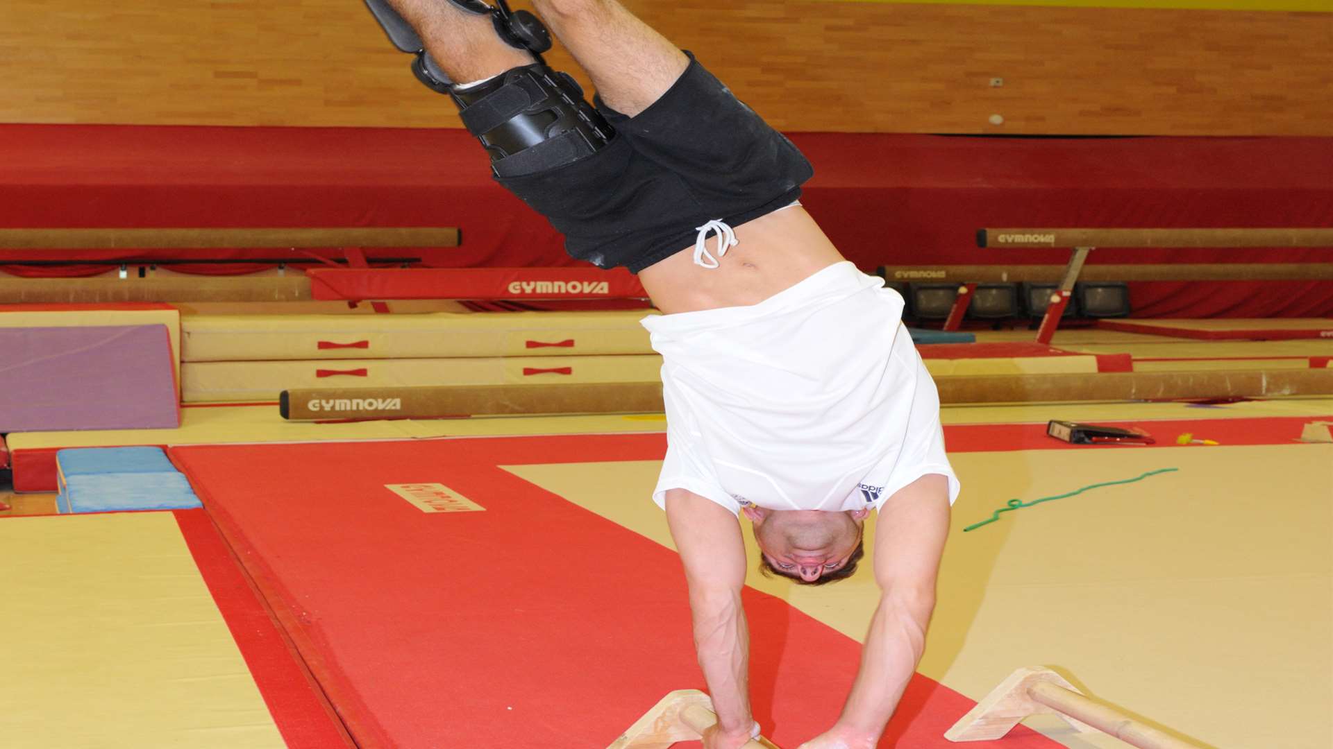 Giarnni makes a handstand in a leg brace seem easy.