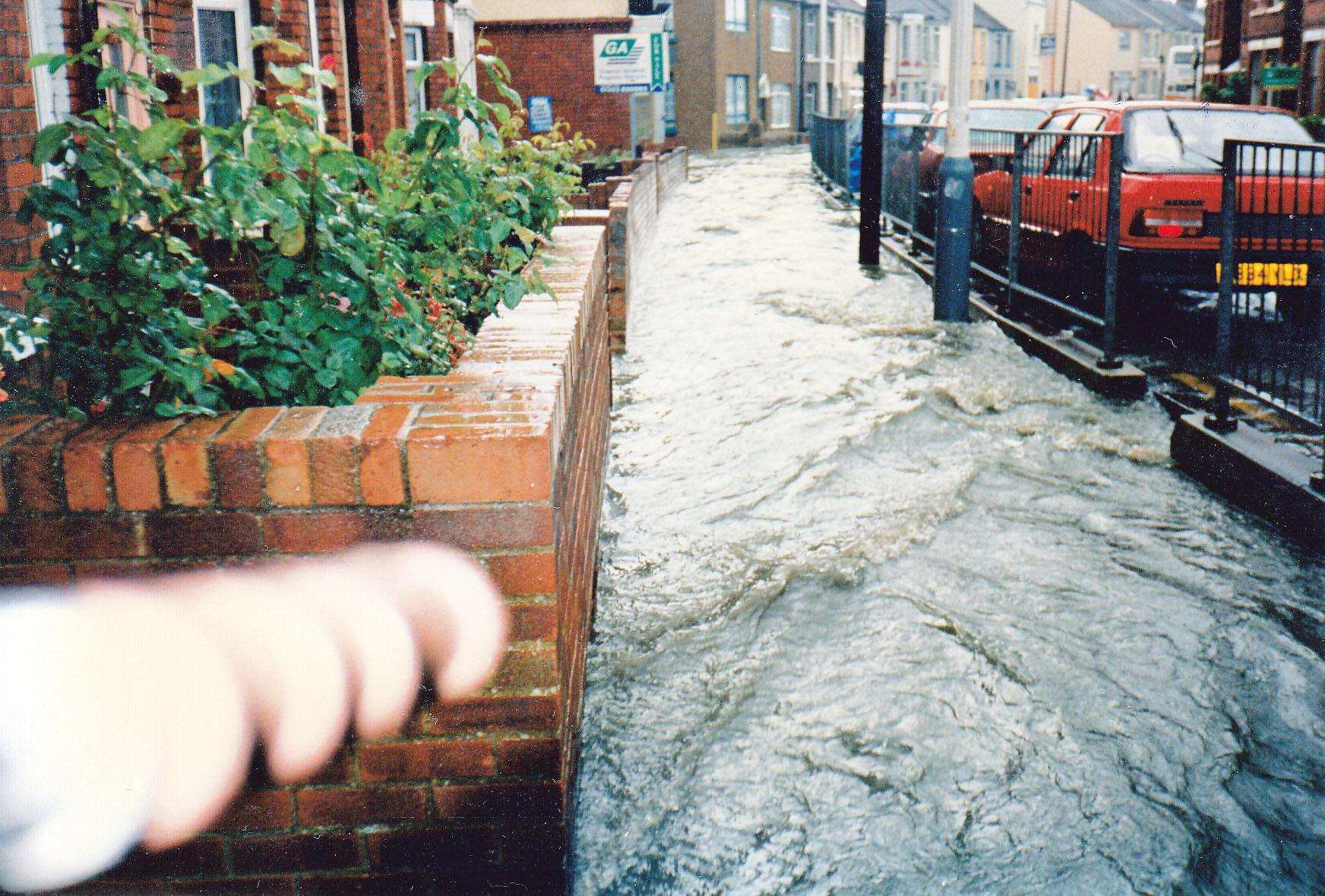 Water gushing down the Pavilion Road path. Picture by Pam Dray in the book Folkestone and District Through Time, Amberley Publishing