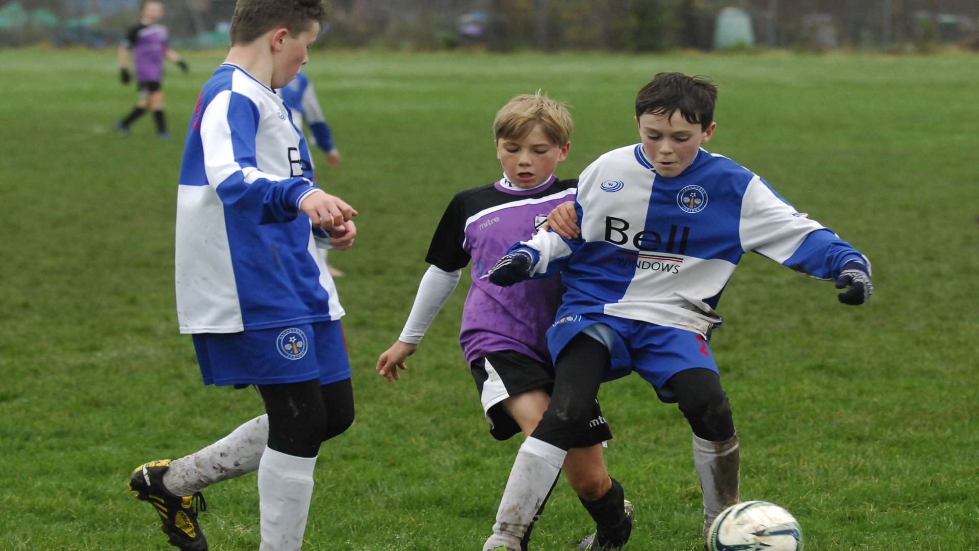 Bredhurst Juniors under-13s (blue and white) get ahead of Anchorians in Division 3 Picture: Chris Davey