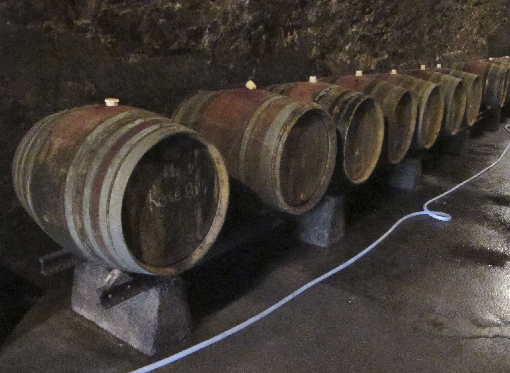 Barrels of wine at Le Domaine de la Roche Bleue