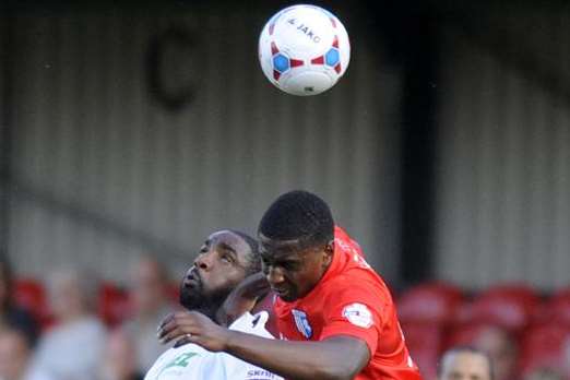 Gills new signing Kortney Hause in an aerial battle against Dover Picture: Tony Flashman