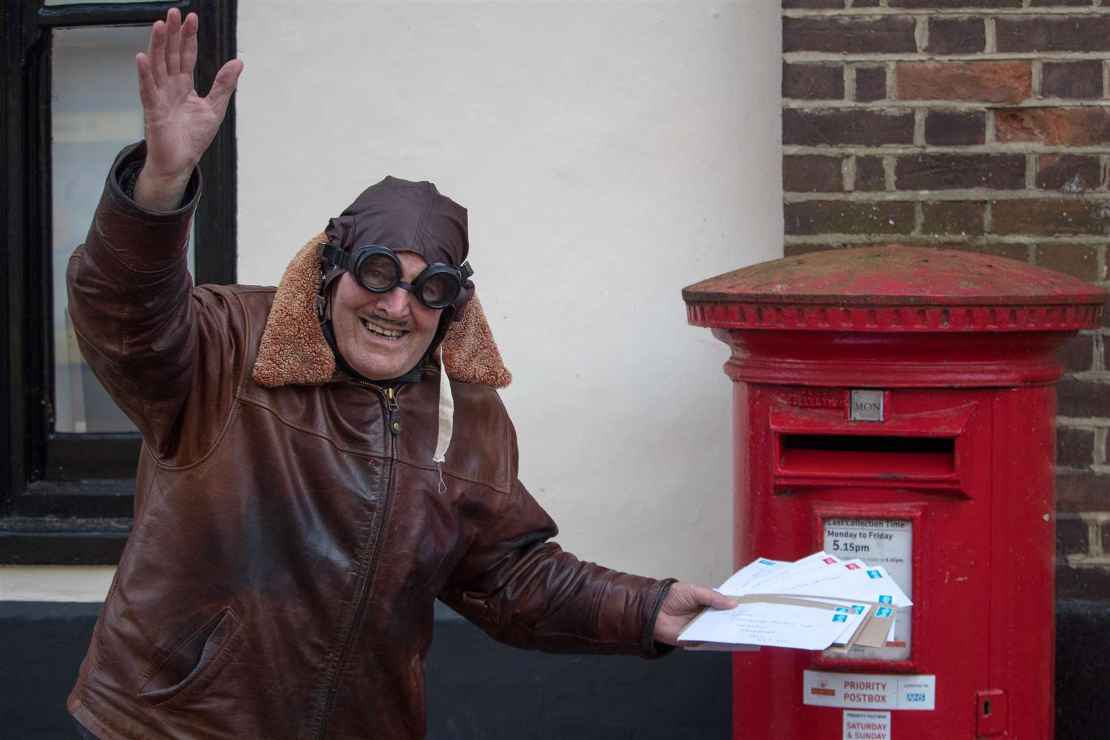 Sittingbourne's whistling postman Dale Howting turned to airmail to post his cheques to the charities he has been collecting for during the past year because he could not deliver them personally because of the Covid lockdown. Picture: Michael Bennett
