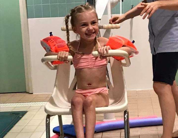 Ellice Barr waiting to go swimming as part of her physiotherapy