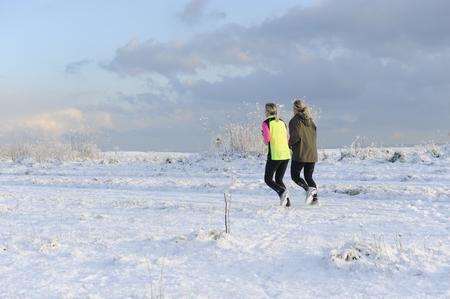 Joggers brave the snow in Walmer yesterday. Picture: Tony Flashman