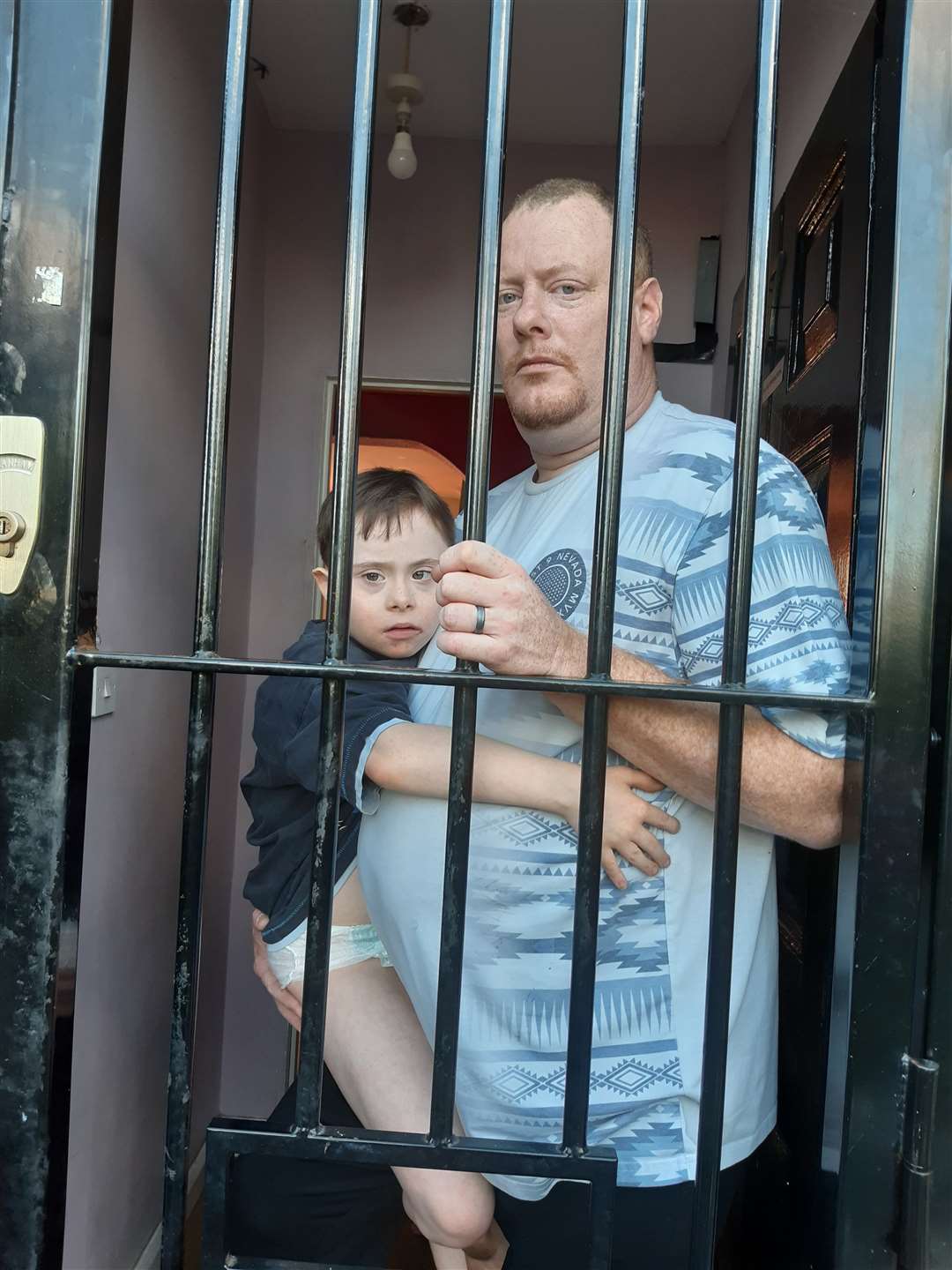 Stephen and Mitchell inside the security gate at their front door