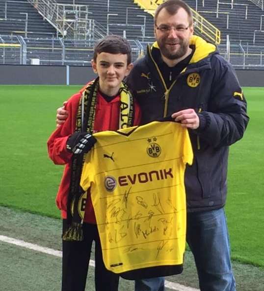 Jonjo is seen off with a special gift from Borussia Dortmund.