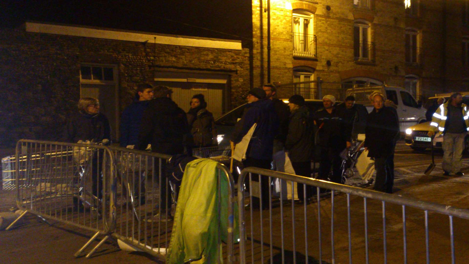 People queue to collect sandbags in Sandwich town centre