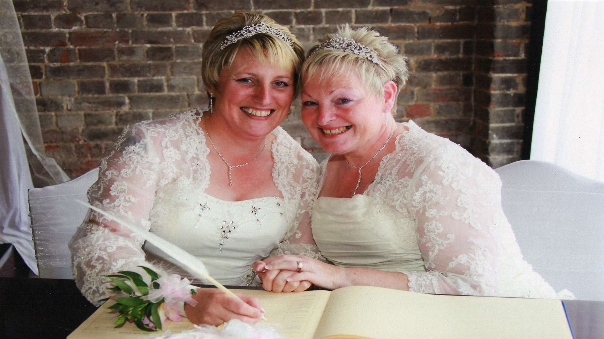 Gillian and Kim Carrington, pictured during their civil partnership at Cooling Castle in 2012, picture Nigel Barrett