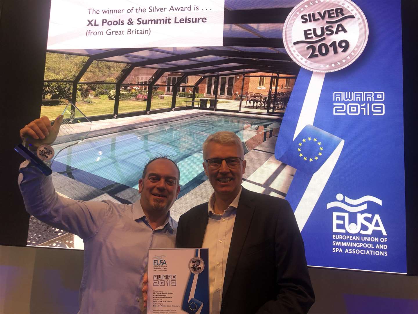 Anthony Exell, MD for XL Pools, with SPATA Managing Director Chris Hayes at the European award ceremony. The pool behind them was named the second best in Europe in the domestic pool enclosure category