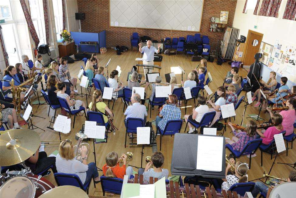 Graham Harvey conducting the summer school orchestra