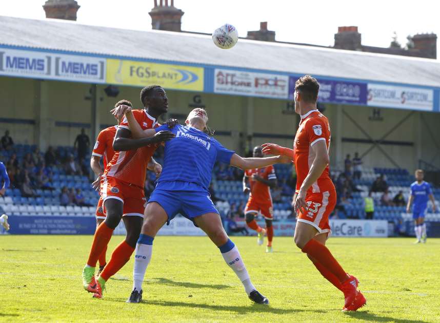 Gills striker Tom Eaves challenges for the ball Picture: Andy Jones