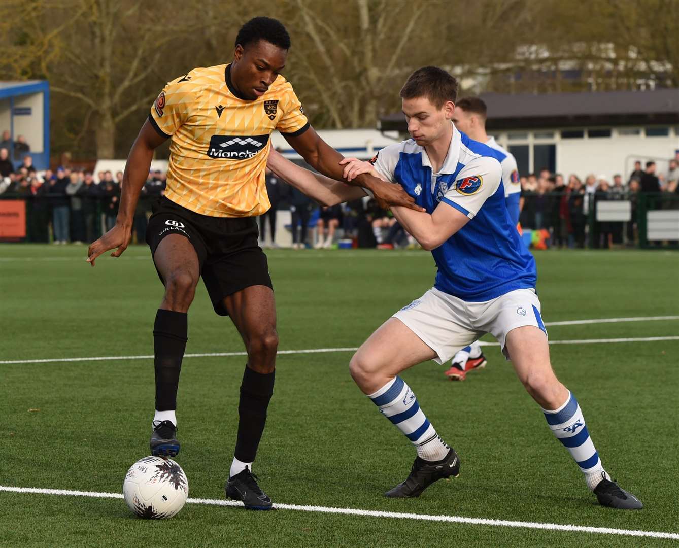 Raphe Brown of Maidstone with Tonbridge Angels defender Ethan Sutcliffe. Picture: Steve Terrell